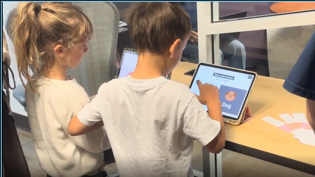 Kids choosing together on a tablet