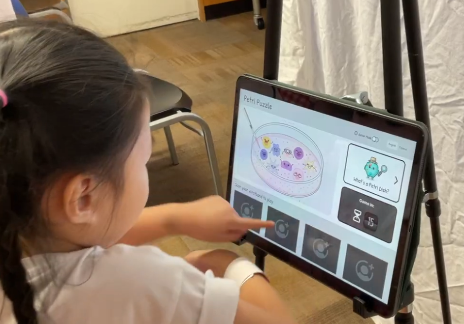 Child engaged with a tablet during testing